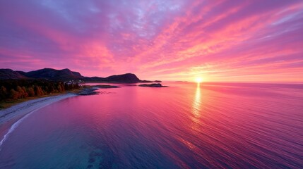 Obraz premium A beautiful sunset over a body of water with a beach in the foreground