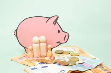 Inflation, minimum wage, increase living costs, child benefit, family support, piggy bank, Euro banknotes money, poverty