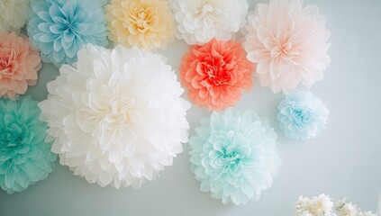 Colorful paper flower decorations on a wall.