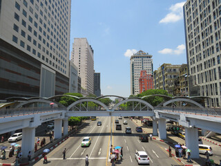 17th April 2025 - Yangon, Myanmar: View of a busy street from an aerial walkway.