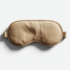 Tan fabric sleep mask flat lay on white background