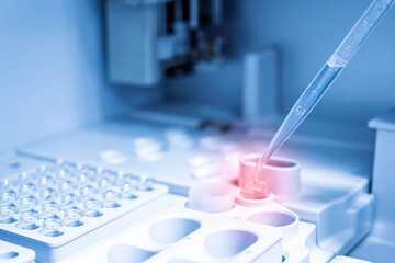 Scientist hand holding and using droplet drop reagent for blood chemical analysis in automatic...