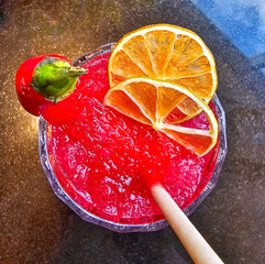 Cocktail with red pepper and lemon