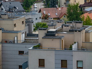 Modern urban housing complex with flat roofs, balconies, and geometric architecture. Dense...