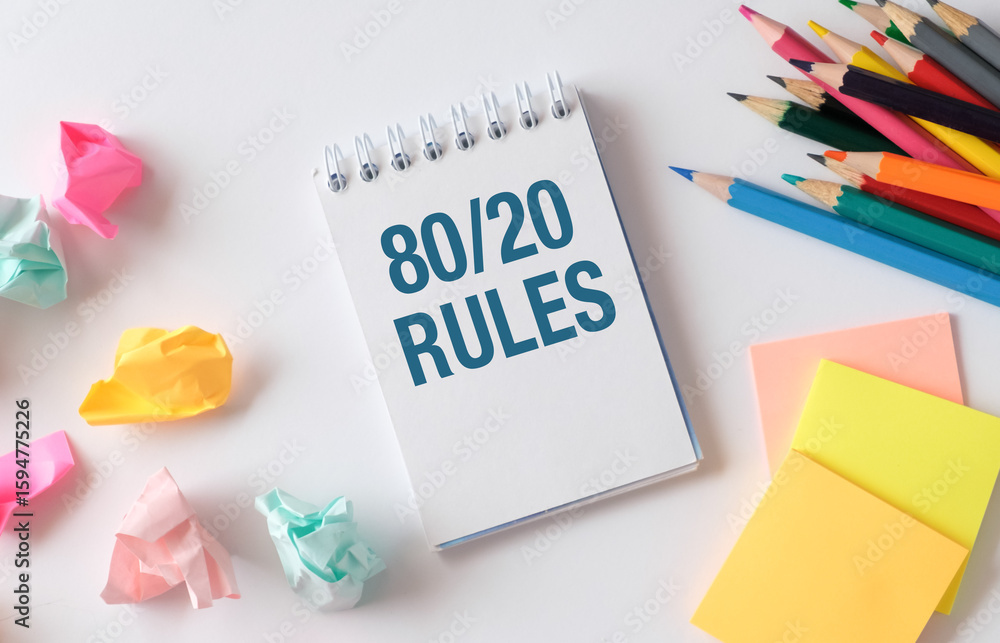 Poster a notebook with the words 80 20 rules written on it