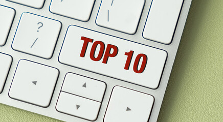 A white keyboard with the word top 10 written on it