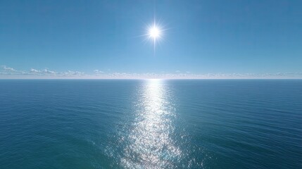 Obraz premium Serene Ocean Horizon Under Clear Blue Sky with Bright Sunlight Reflection on Calm Water Surface
