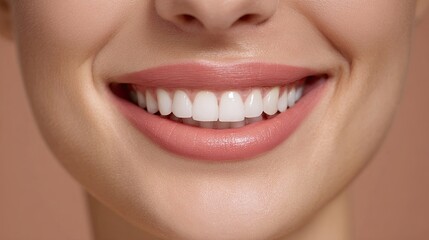 Obraz premium Close-up of a Smiling Woman with Healthy Teeth and Radiant Skin Against a Soft Background