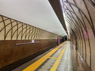 Modern Almaty Metro Station with Decorative Walls and Empty Platform