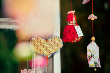 Colorful traditional Turkish crafts, including evil eye amulets and ceramic ornaments, displayed at a local artisan shop.