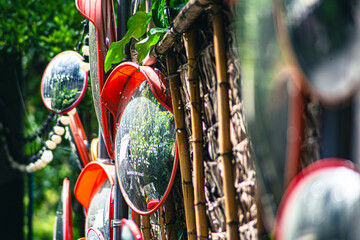 Circular traffic mirrors arranged in multiple pieces as art.