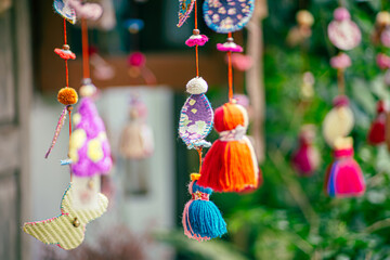 Colorful traditional Turkish crafts, including evil eye amulets and ceramic ornaments, displayed at a local artisan shop.