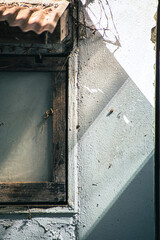 abstract light and shadow on old and dirty window in dark background,with clipping path