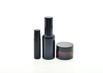 Obraz premium Black bottle, Collection of empty glass bottles sitting together on a surface