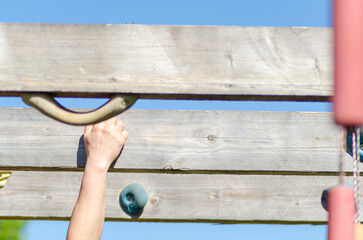 Detail of a hand and arm during an outdoor fitness session.