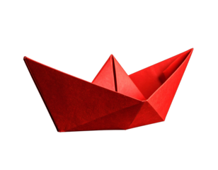 Red origami paper boat on a black background