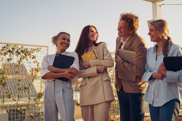 Experience dynamic team collaboration while enjoying a stunning rooftop view above the city
