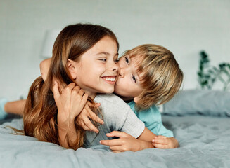 Portret of brother and sister having fun together at home