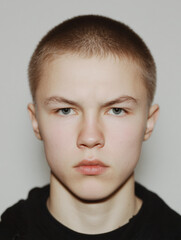 Youth Male Portrait Serious Expression Model Image Closeup Face Style Cool Skin Natural Character Headshot Modern Teenager Neutral Attitude Strong Eyes Staring Intense Expression Studio 