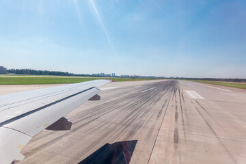 Fototapeta premium View from the airplane window during takeoff at Sheremetyevo airport at summer