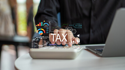 Business person using calculator with virtual tax dashboard, representing digital tax planning,...