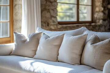 Close-up of a white fabric sofa with beige linen pillows, positioned near a window. French country home interior design for a modern living room, Generative AI