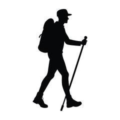Fototapeta premium Silhouette of a hiker with a backpack and trekking pole walking