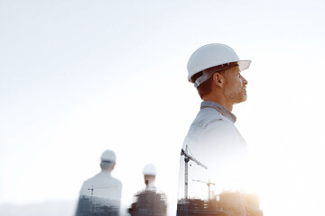 Double exposure image of a construction worker wearing a hardhat, overlaid with a construction site. Conceptual, visionary, leadership, planning, future.