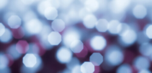 Fototapeta premium Abstract background with blurred lights in blue, white, and purple colors, evoking a cool and ethereal ambiance ideal for digital designs and night-themed projects.