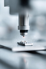 Precision manufacturing. Hightech laser processing a metal part, creating sparks. Symbolizes innovation, engineering, and modern technology. Ideal for industrial or scientific content.