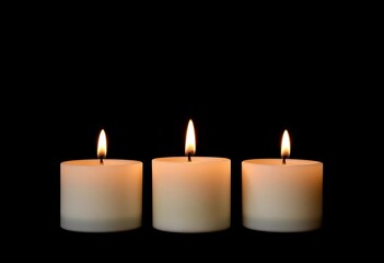 Three burning candles, isolated on black background, frontal view,  spiritual,  mood