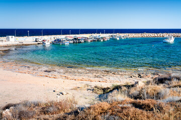 Picturesque bay beach Agios Georgios Beach on the island of Cyprus with turquoise water, Peyia.