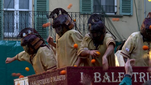 Italy, Ivrea, 03-02-2025. Details orange battle at the Historical Ivrea carnival. Rione del Borghetto district. Slow motion 4K