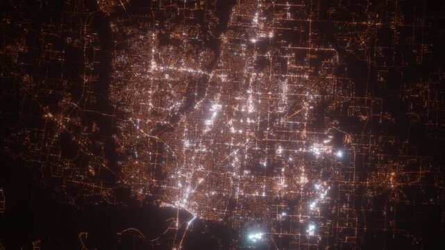 Memphis (Tennessee, USA) aerial view at night. Top view on modern city with street lights. Camera is zooming out, rotating clockwise. Vertical video. The north is on the left side