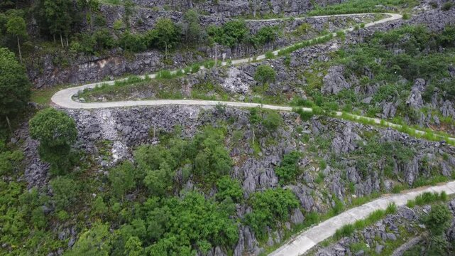 Ha Giang Vietnam - Aerial Drone View of Lacet Road (Hairpin Turns) on Mountainous Scenic Ha Giang Loop