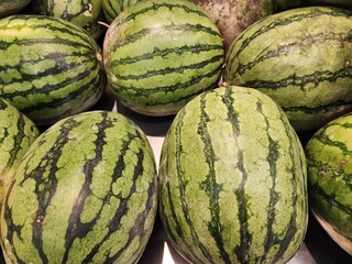 Fresh Watermelons on Display in a Market Setting for Sale