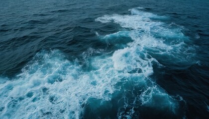Fototapeta na wymiar Dark blue ocean waves with white foam create a turbulent texture. Dynamic sea swirl captures powerful water motion, deep aquatic surface patterns, and wild currents.