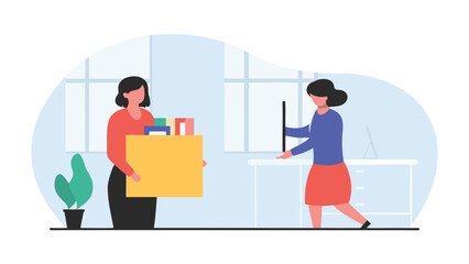 Woman carrying box while another works at desk in office with plant near window and computer setup