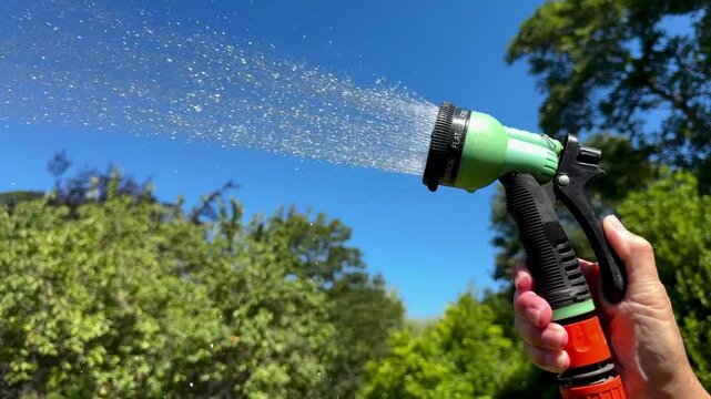 Watering the garden with a hosepipe - water shortage - Hosepipe ban