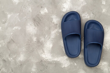 Blue sandals on concrete background,top view