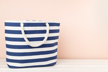 Fototapeta premium Blue beach bag on wooden table