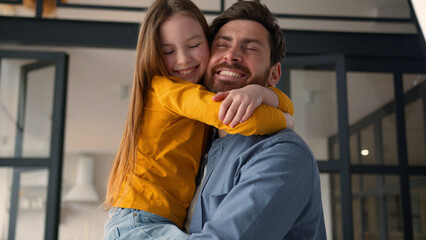 Glad cheerful happy Caucasian family hugging father man male dad guy cuddle smiling little child...