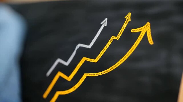 Dynamic yellow arrow on a chalkboard representing progress and development in conceptual art.