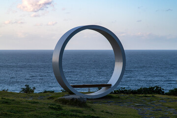 circle-shaped bench on the seaside cliff