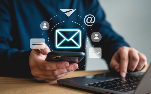 Digital marketing and email communication concept with hands holding smartphone beneath glowing neon blue envelope icon, floating minimalist communication symbols