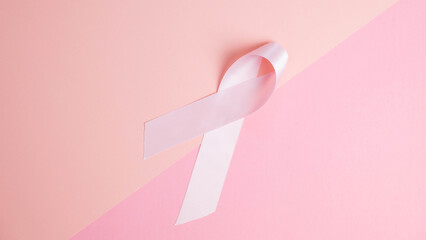 Breast Cancer. Pink ribbon on two shades of pink background. Awareness concept