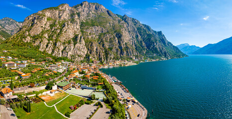 Aerial view of Limone sul Garda, a colorful lakeside town in Italy nestled between Lake Garda and...