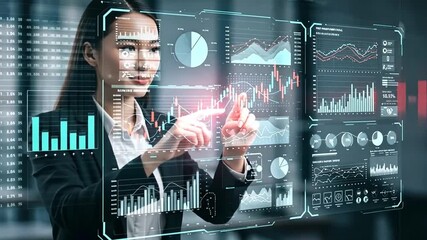 A businesswoman interacting with digital financial data on a screen. - Powered by Adobe