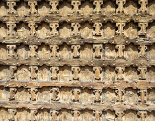 Facade of Basilica di Santa Anastasia in Verona, Italy, with Gothic architecture and brick exterior under a bright sunny sky