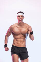 Fit muscular man running for health and endurance. Male athlete training outdoors to maintain strong body and active lifestyle.